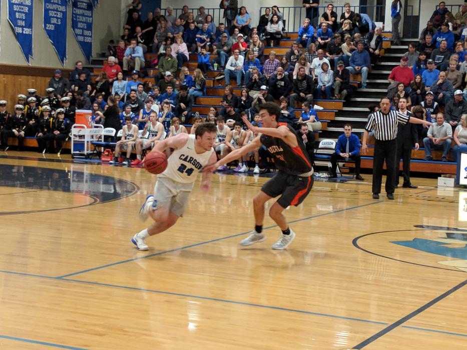 Abel Carter drives on a Douglas defender.