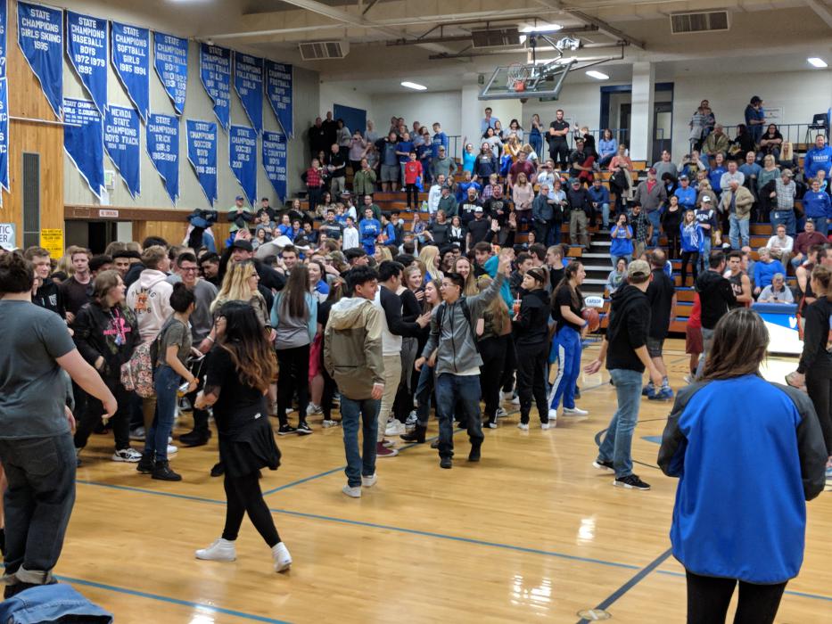 Carson fans rushed the court after the intense victory.