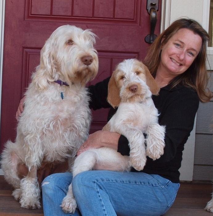 As a puppy Addie (right) poses with Stacey Belt and her mom