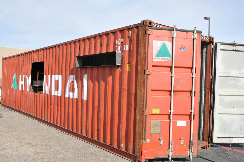 A 320-square-foot shipping container is being converted into a single-unit housing prototype in a WNC welding class.