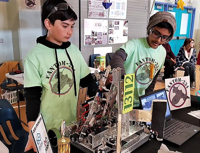 ​Miles Frewert and Niko Chitturi explain how their robot functions.