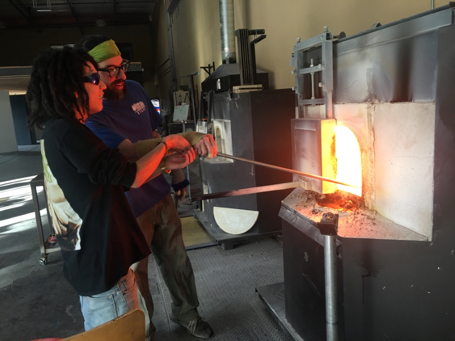 Senior Tommy Lopez learning to blow glass. Carson School District photo.