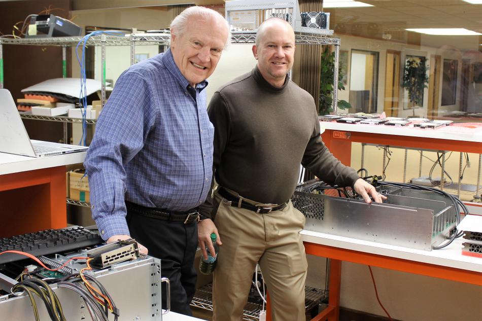 Cubix owner Al Fiegehen (left) and son Eric create the next generation of high speed computers used in artificial intelligence.
