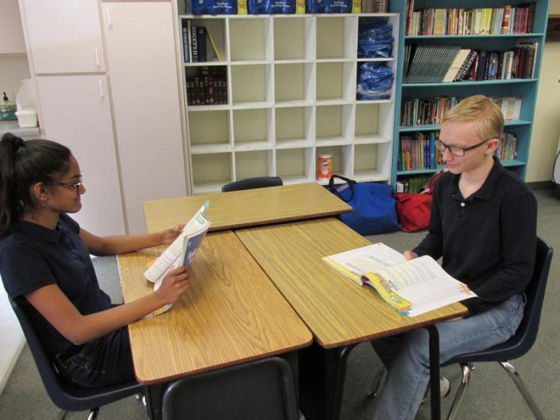 Rithika and Hayden practicing their spelling words.