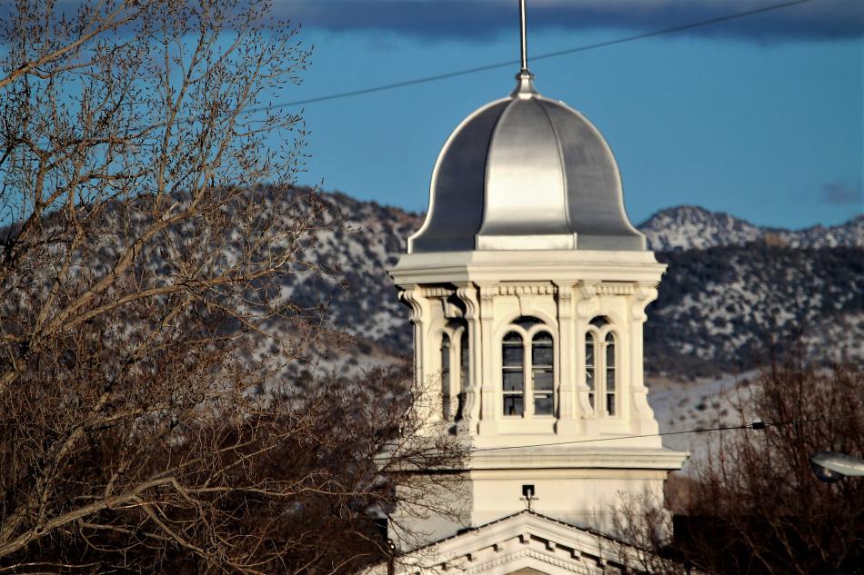 Late afternoon sun reflects off the silver dome of the Nevada Capitol Sunday.