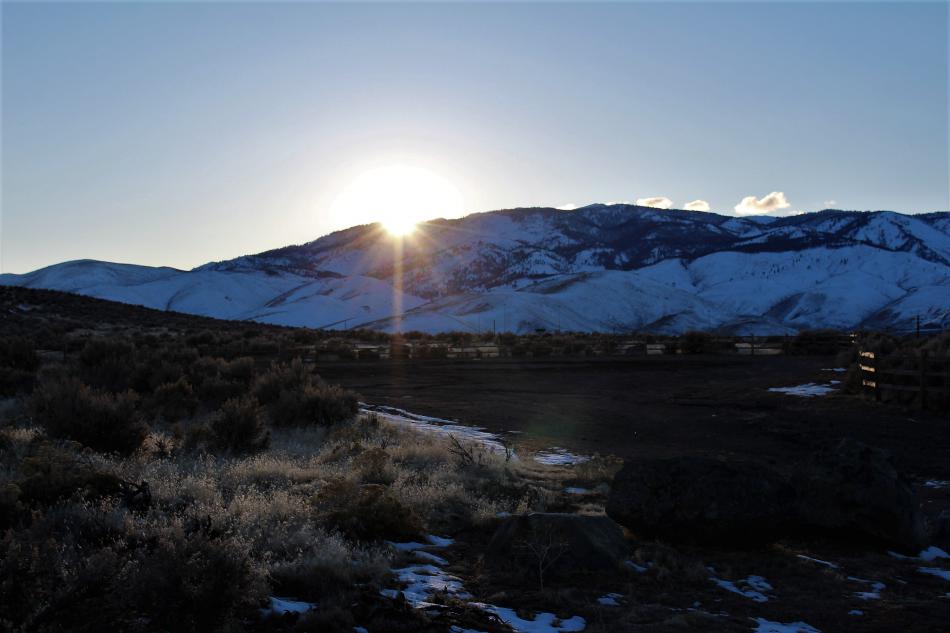 The sun sets behind the Carson Range Sunday afternoon.