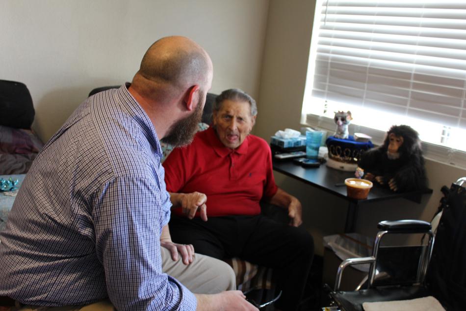 Meals on Two Wheels’ Randy Gaa visits with Richard Dilley while delivering lunch from Meals on Wheels.