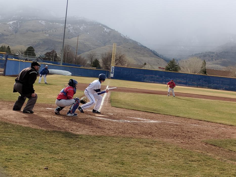 Senior Kyle Glanzmann drops a bunt during the 5th inning.