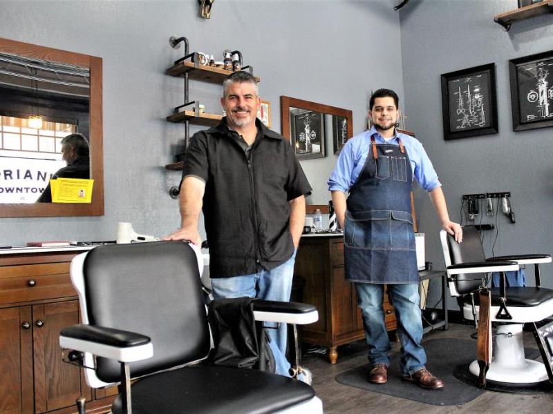 Photos by Brett Fisher. Barbers John Russell (left) and Nick Fontanez at their chairs.