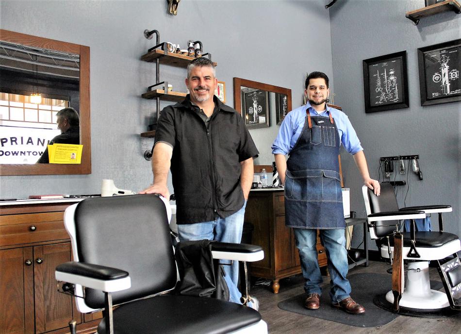 Photos by Brett Fisher. Barbers John Russell (left) and Nick Fontanez at their chairs.