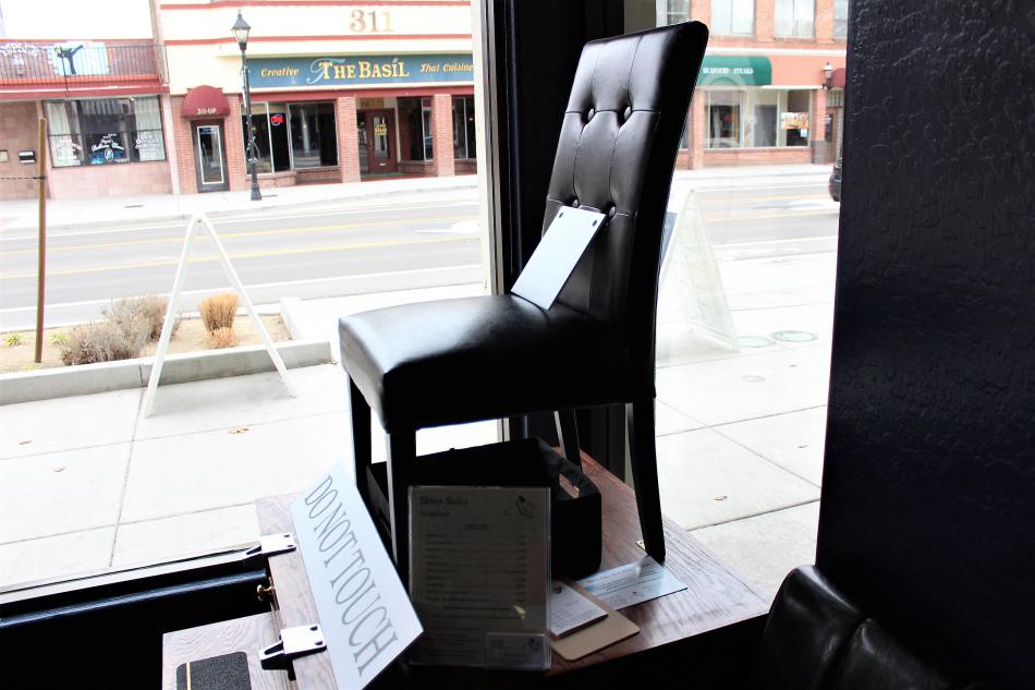 Mike Smith's Shiny Soles shoe shine chair inside Cipriani's Downtown Barber Shop.