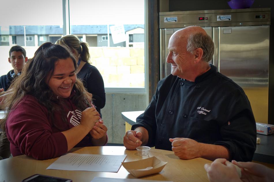 Eighth grader Arely Avina, left, with John Hurzel