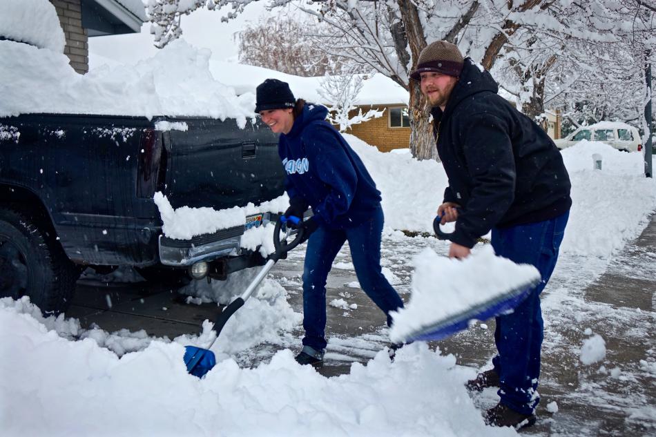 Carson City residents shovel their driveway Friday morning.