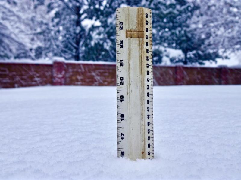 Photos by Jim Gustafson. More than a foot of snow is measured in northwest Carson City Friday morning.