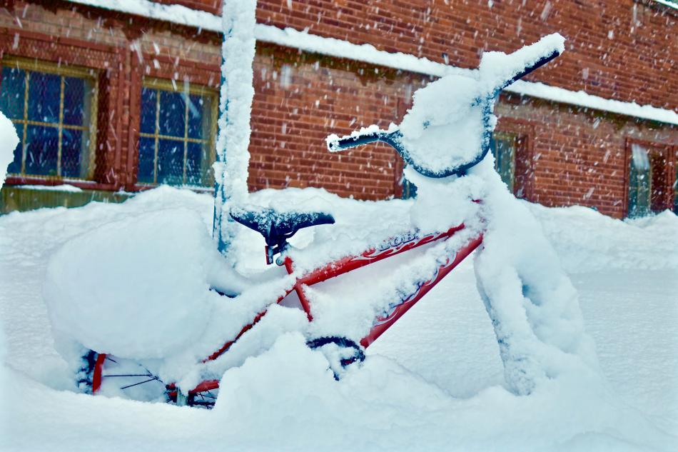 A bicycle at the Northern Nevada Children's Museum covered in snow.