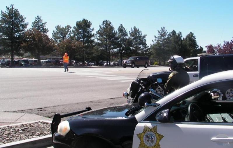 A Carson City sheriff's deputy decked in bright orange crosses Stewart Street.