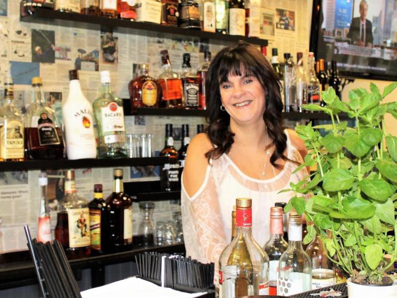 Bella Vita Bistro owner Lori Baxter uses grown basil to provide flavor to her freshly prepared dishes. Photo by Ronni Hannaman