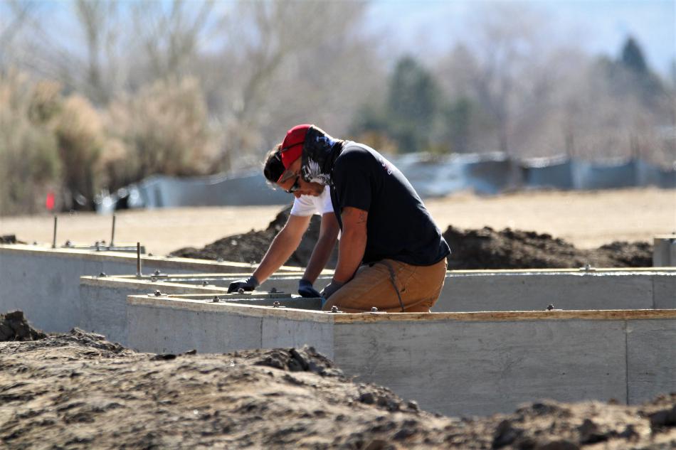 Construction workers rest while working on a foundation in the Silver Oak Development.