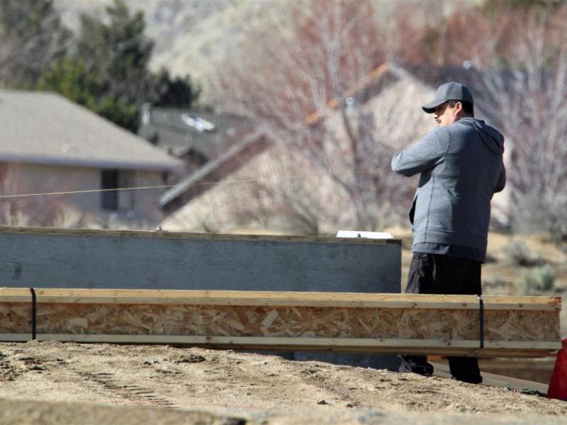 Photos by Brett Fisher. A concrete foundation is measured in the Silver Oak Development.