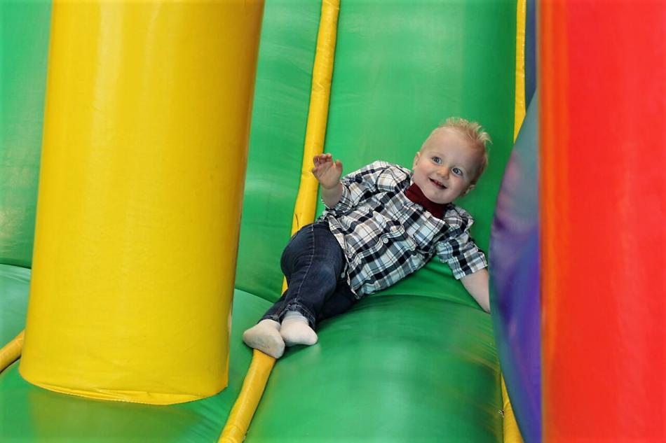 A child slides down a bounce house slide Thursday at Carson Tahoe Hospital.