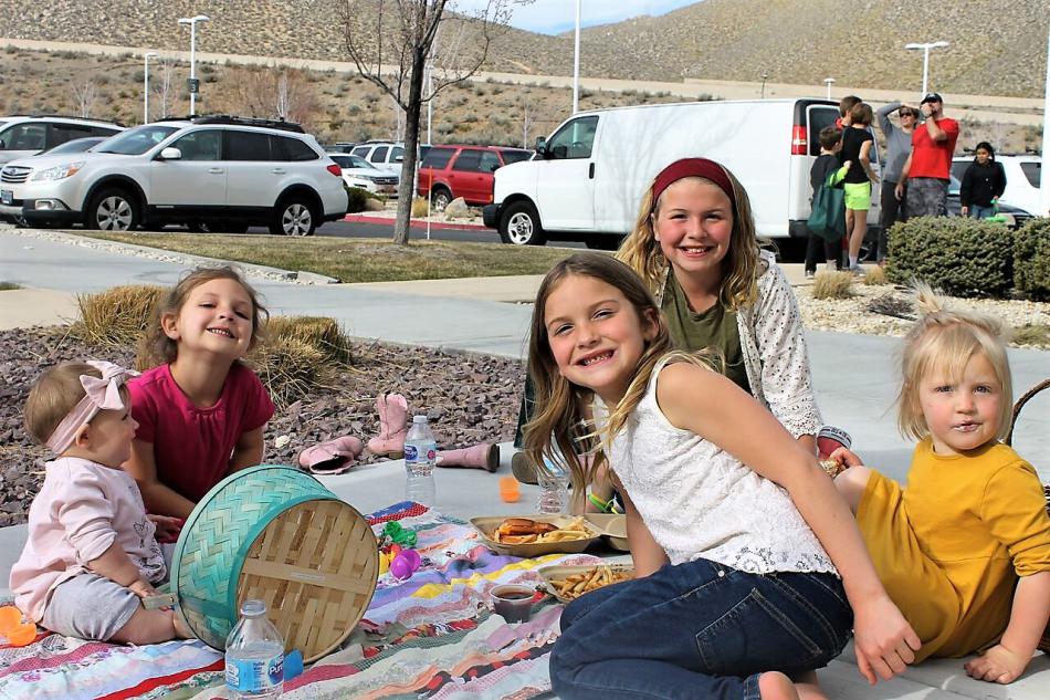 Children relax on the grounds of Carson Tahoe Hospital during its Easter Eggstravaganza.
