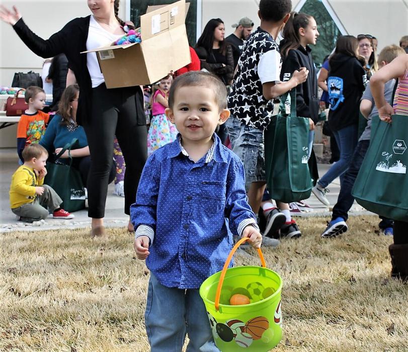 A child with his basket of Easter eggs.