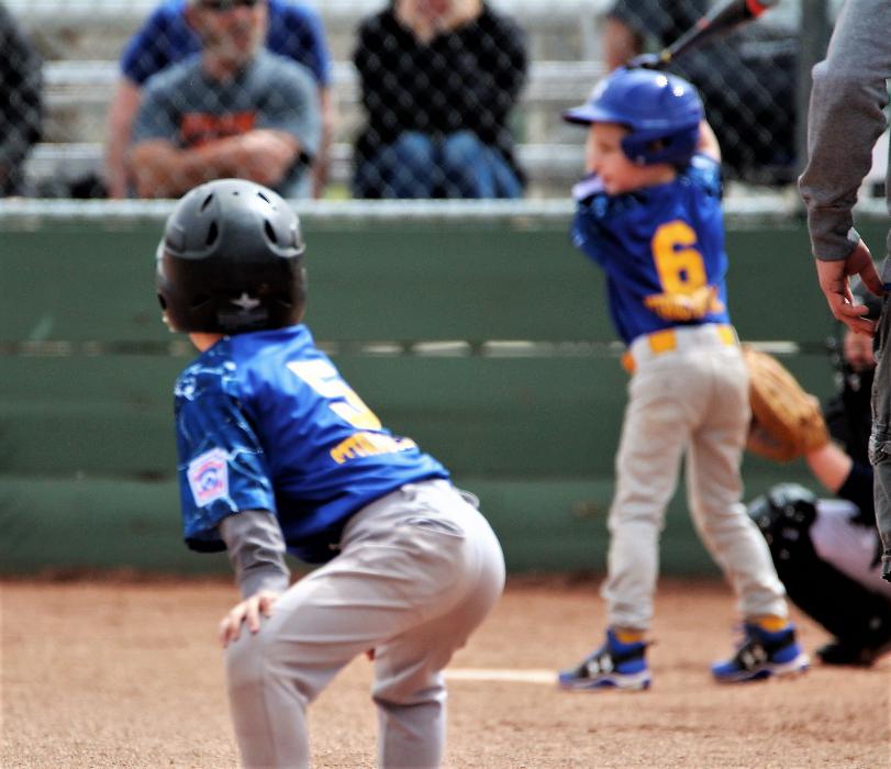 A base runner waits at third base to advance toward home plate Saturday at Governor's Field.
