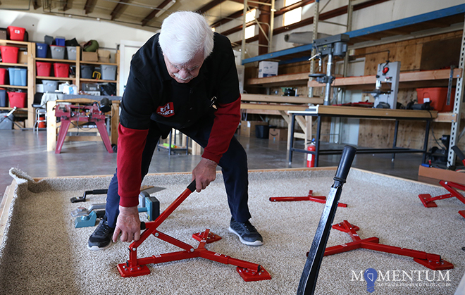 Mario Garzanelli works his carpet-stretching device he invented. Photos by Cathleen Allison, Nevada Momentum