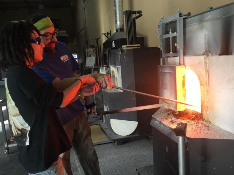 Senior Tommy Lopez learning to blow glass. Carson School District photo.