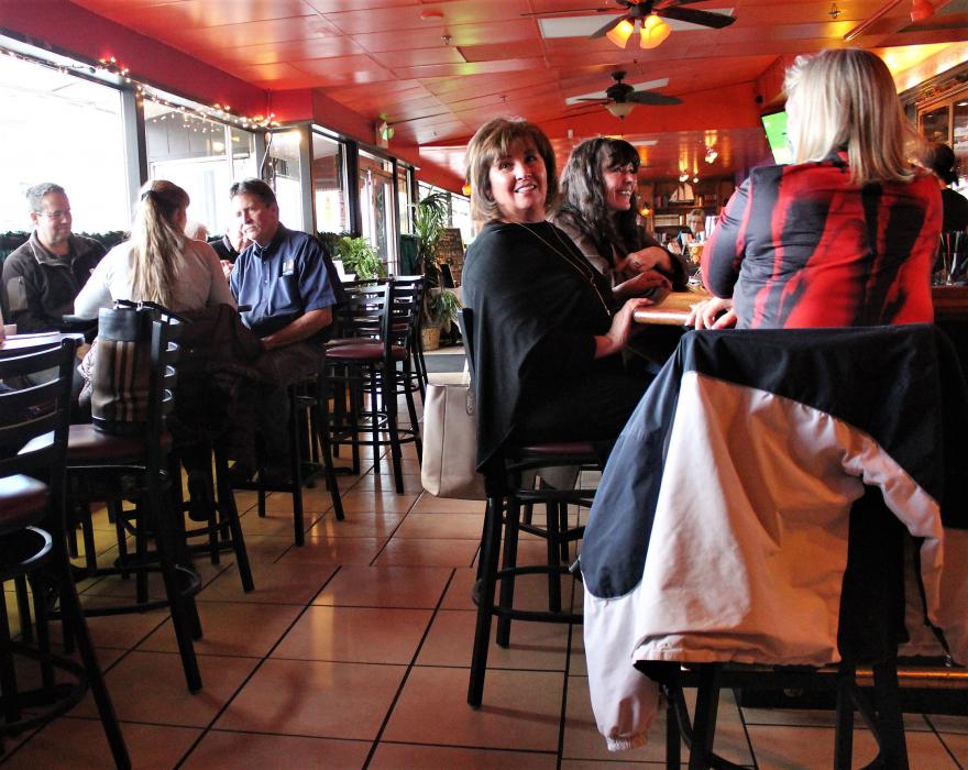 Photos by Brett Fisher. Patrons inside the lounge at Living the Good Life enjoy live music.