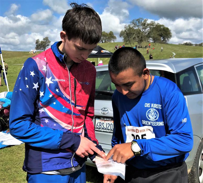CHS Orienteering Team members evaluating the cartography of their map.