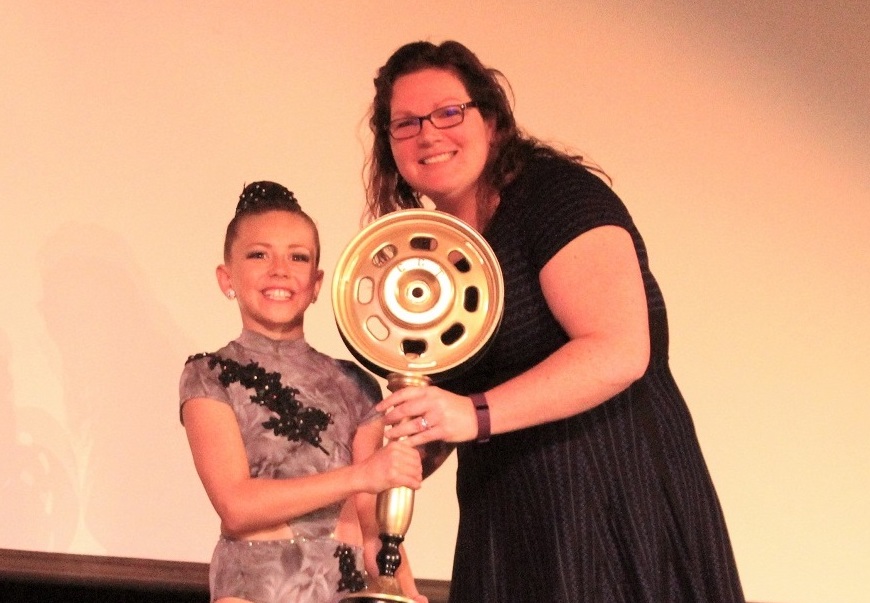 Kyra Gonzales took 1st place and the “Big Wheel” trophy for raising the most money with audience votes.