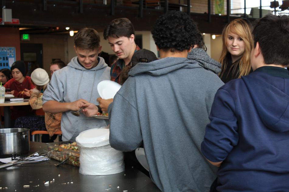 BGC Teen Club members dig in to Panzanella Salad.