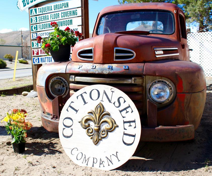 Photos by Brett Fisher. A vintage 1950s era Ford pickup in front of the CottonSeed Company off Goni Rd.