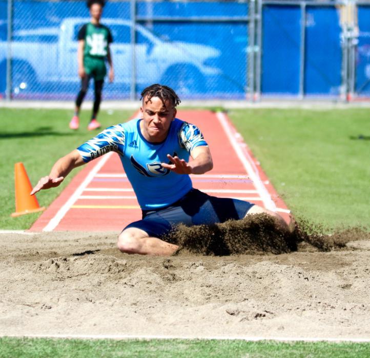 Long jumper lands in the pit.