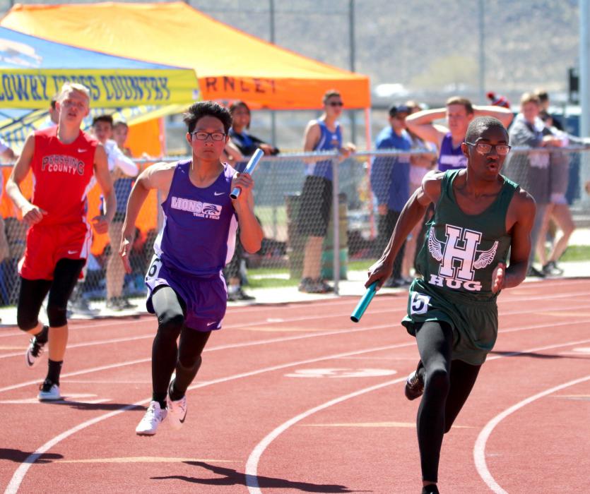 Yerington High relay sprinter rounds the curve.