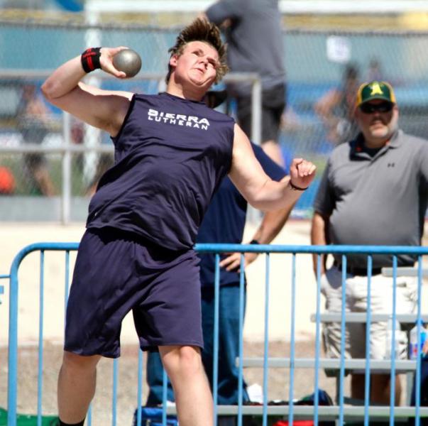 Photos by Brett Fisher. Sierra Lutheran shot putter heaves the steel shot.