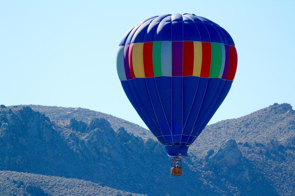 Photos by Brett Fisher. A hot air balloon gains lift near Prison Hill Sunday morning.
