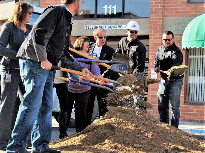 Photos by Brett Fisher. City and Q&D Construction officials turn dirt on W. Telegraph St. Monday morning.