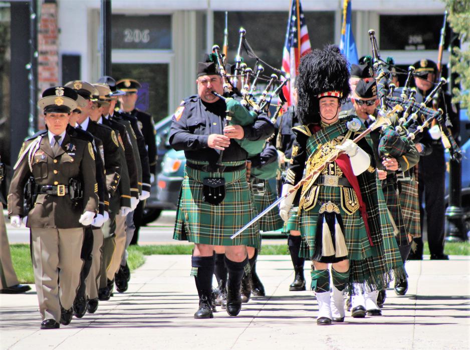 Bagpipe and drum corps precede the colors to start the annual ceremony.