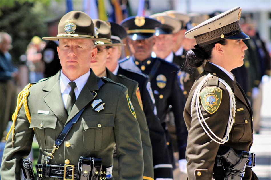 Honor guard member, Deputy Dean Williams of the Carson City Sheriff's Office, follows an LVMPD Officer.