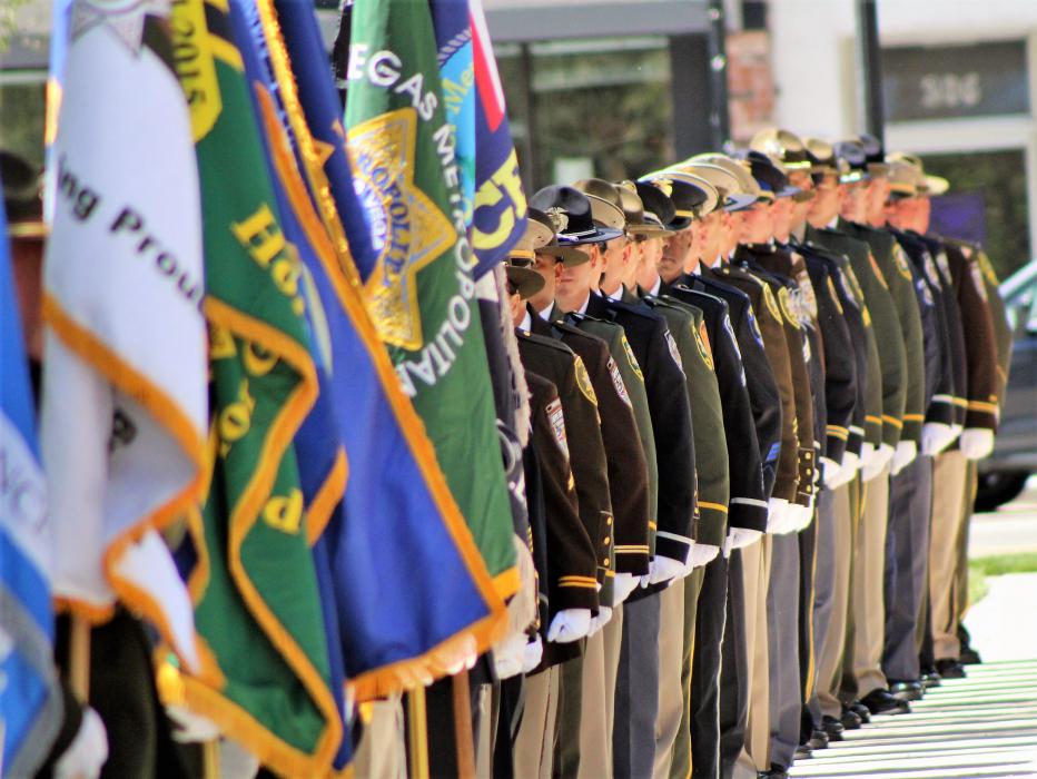 The honor guard at attention and lining the walkway to the memorial.