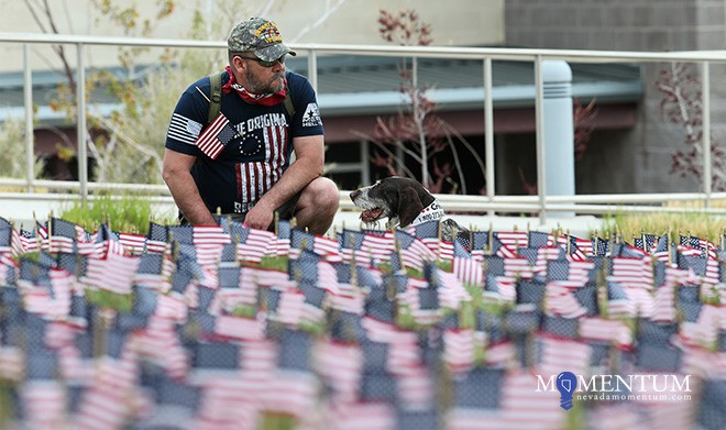 Photos by Cathleen Allison/Nevada Momentum. Michael Fialkowski and his dog Schultz observe Veterans Suicide Awareness at WNC.