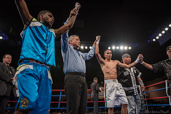 A majority draw is ruled as both Canton Miller, left, and Diego Elzondo’s arms are raised Friday. Photo by Michael Smyth