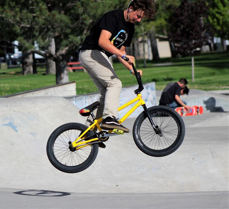 A BMX rider does tricks at the Mills Park skate park.