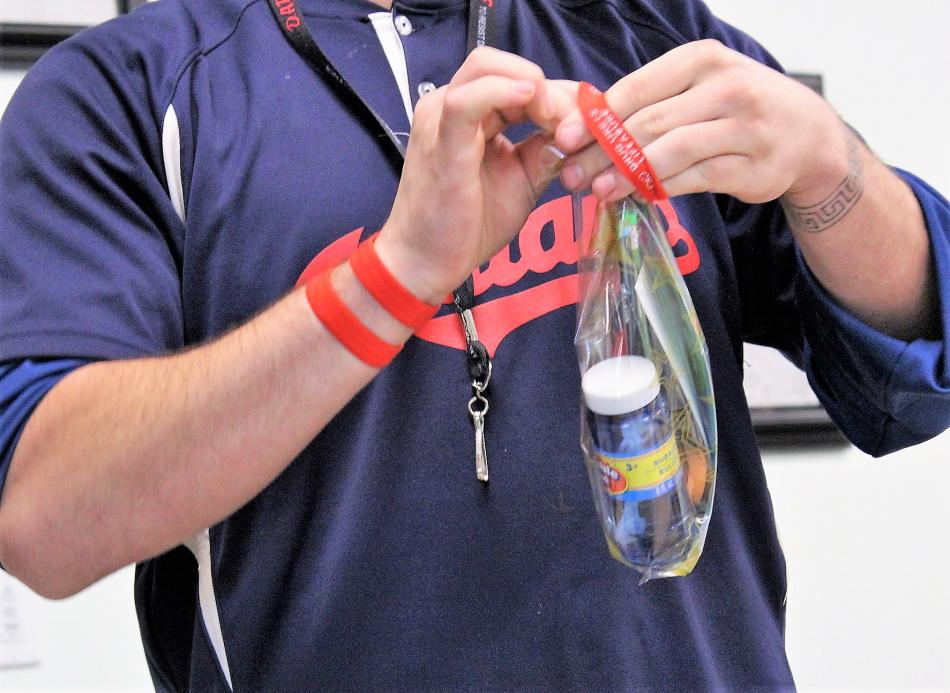 A ribbon is tied around a prize bag.
