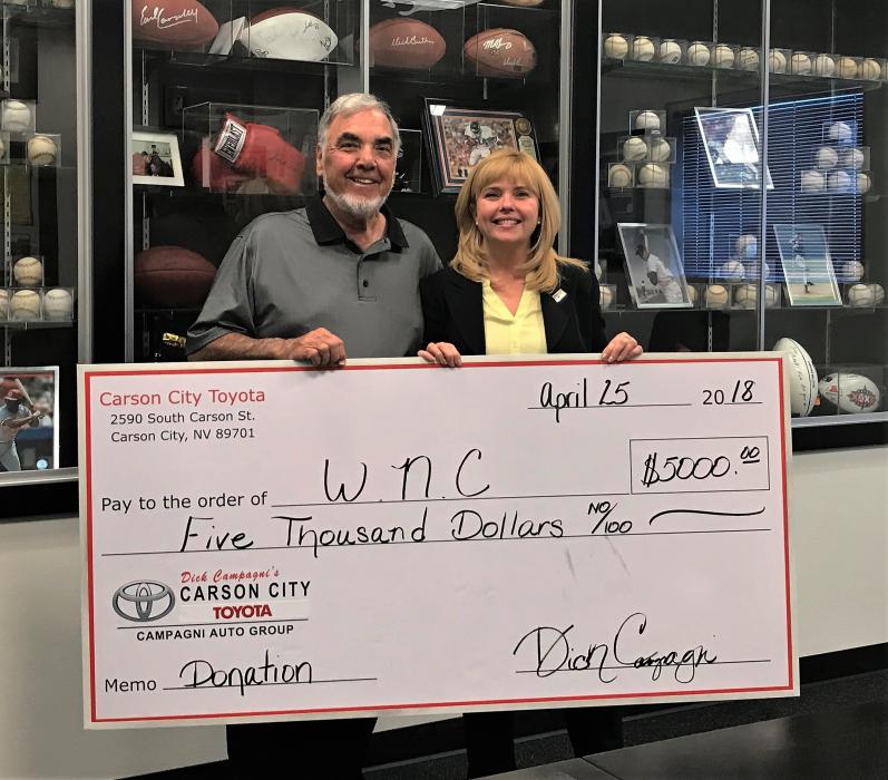 Photos courtesy Carson City Toyota. Dick Campagni presents a check to Nikki Gladys of WNC.