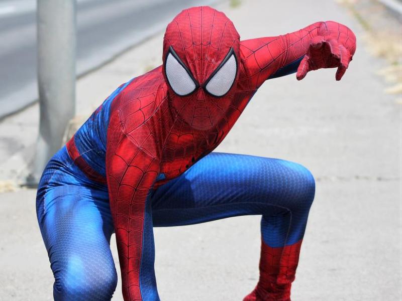 Photos by Brett Fisher. The Amazing Spider-Man poses for photos along North Carson Street Saturday.