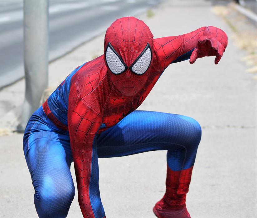 Photos by Brett Fisher. The Amazing Spider-Man poses for photos along North Carson Street Saturday.