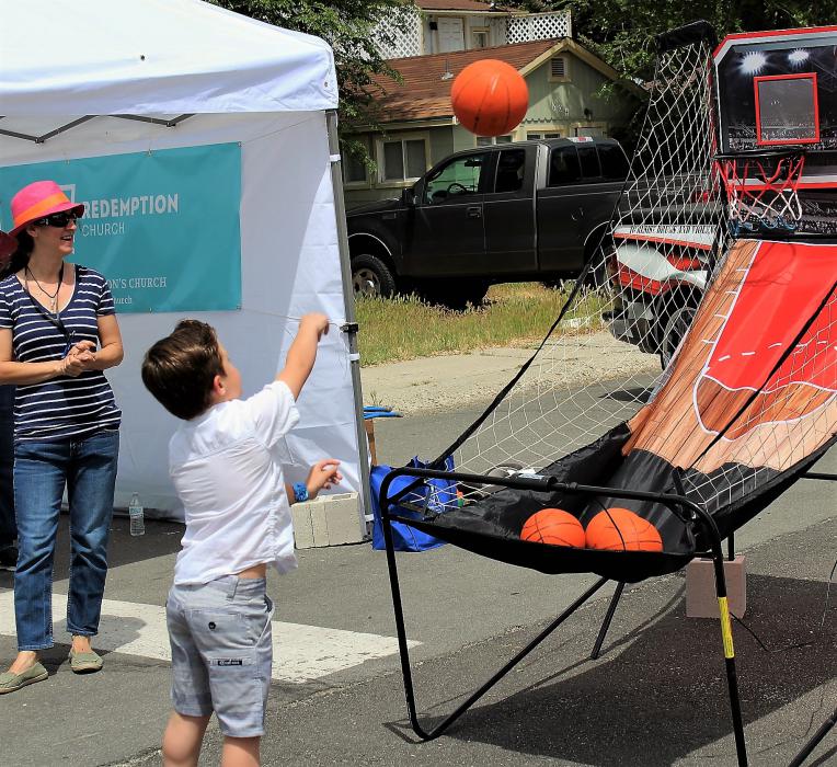 A boy shoots baskets Saturday in front of the Carson City Sheriff's Office.